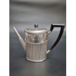 An early 20th century Dutch white metal coffee pot, hallmarked for .833 standard, 1910, the body