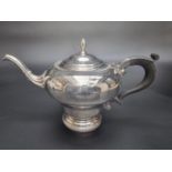 A silver teapot, by Barker Brothers Silver Ltd, Birmingham 1962, 17cm high, gross weight 712g.