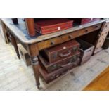 A large Victorian oak desk, 135.5cm wide.