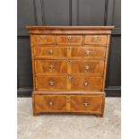 A George II walnut and crossbanded chest on stand, 105.5cm wide, (lacking legs).