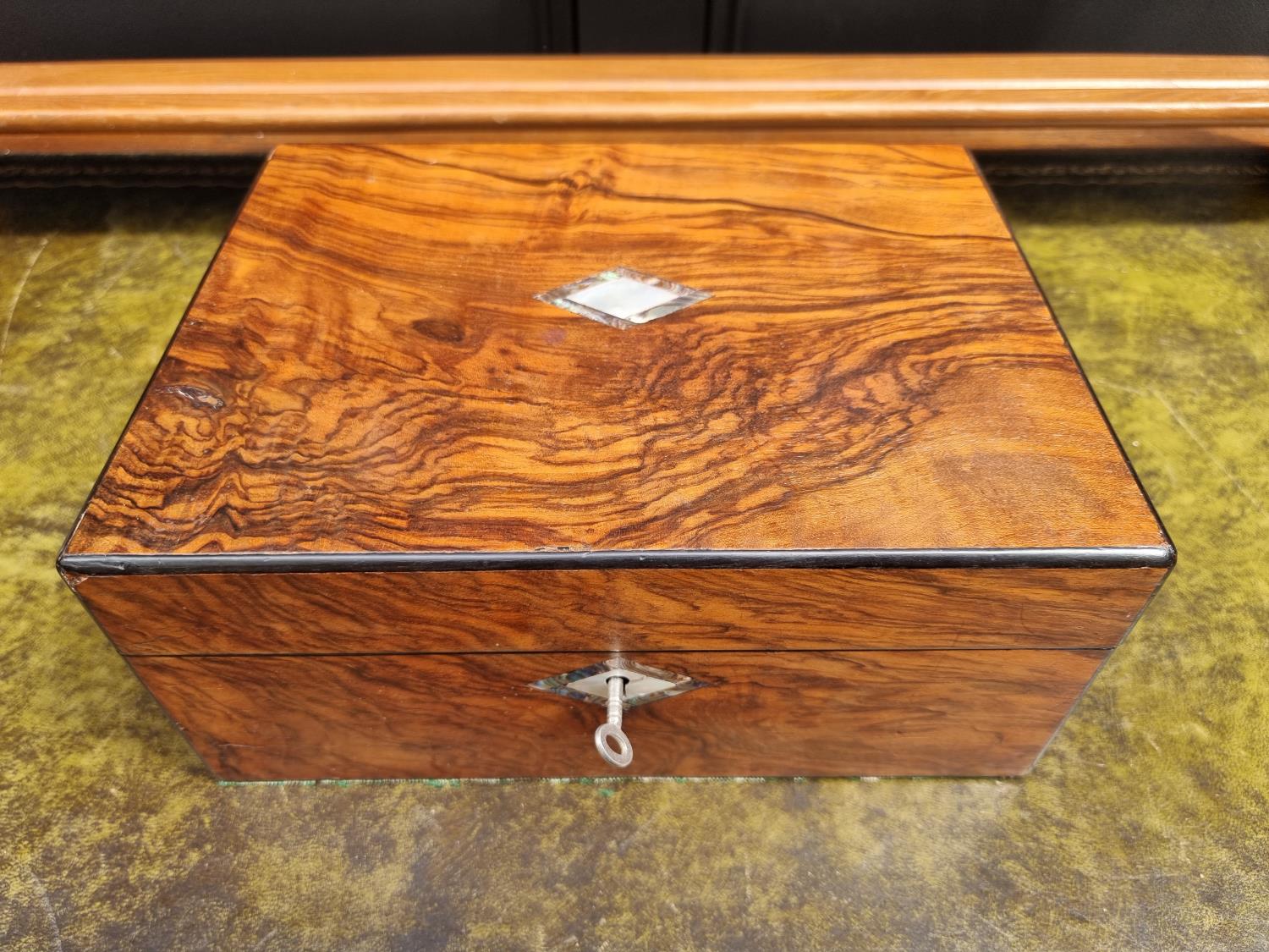 A Victorian walnut and inlaid writing box, 30cm wide.