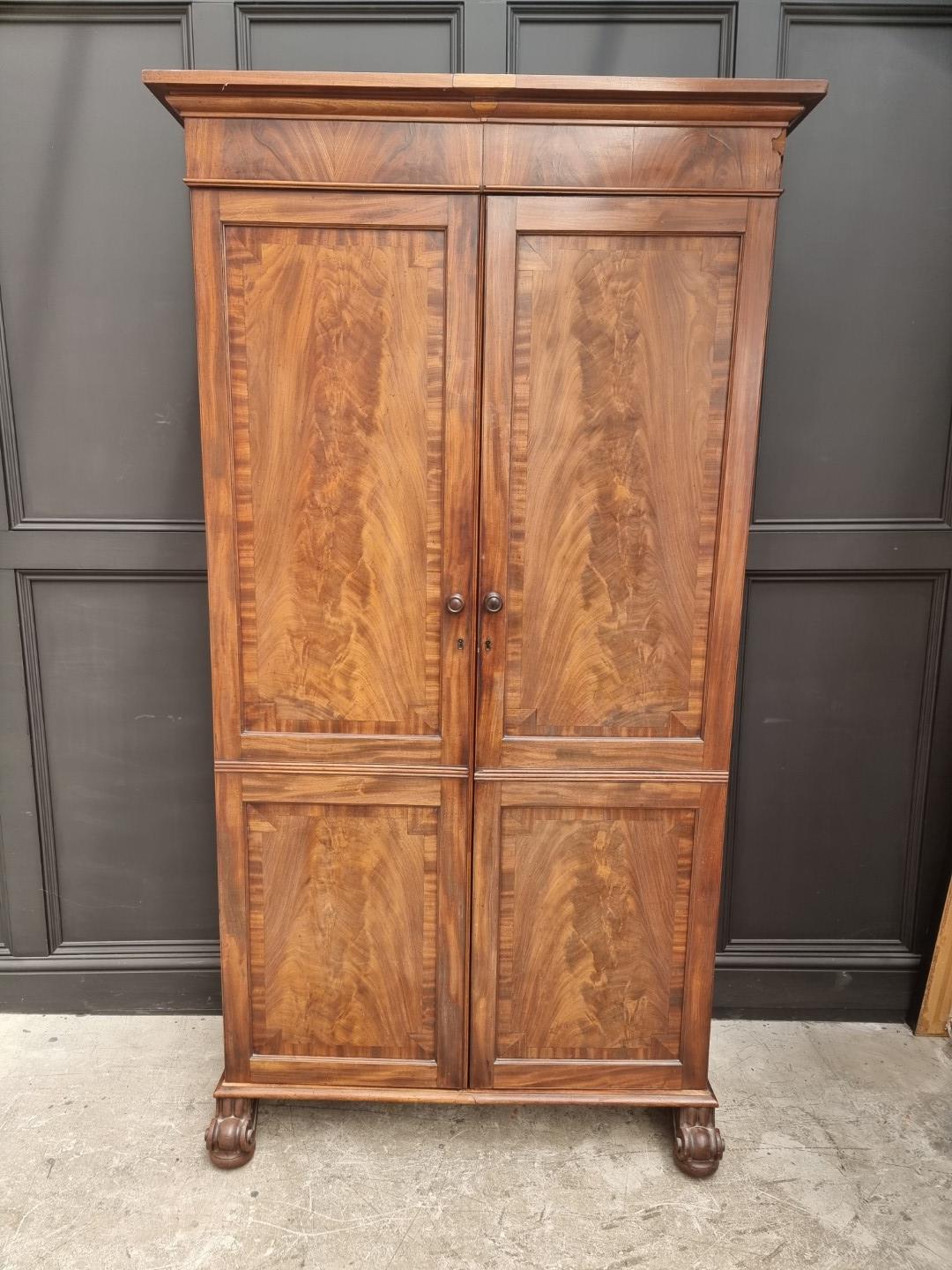 A 19th century mahogany double wardrobe, 111.5cm wide, converted.