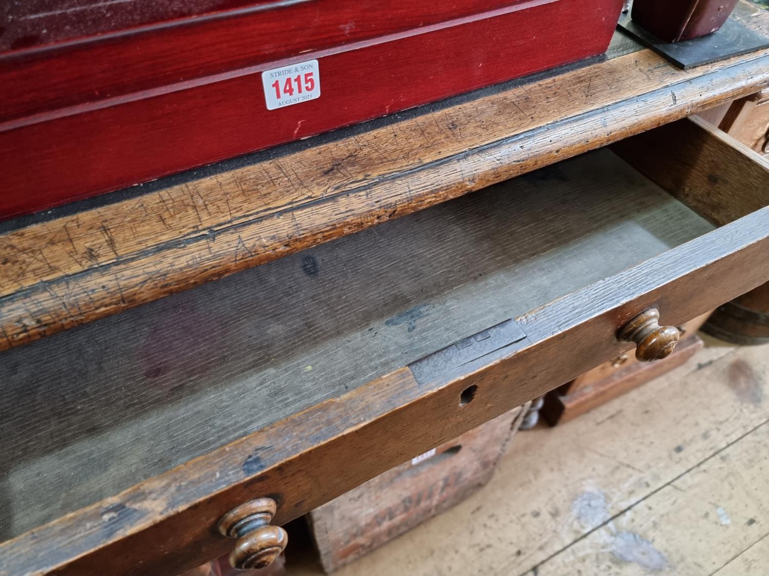 A large Victorian oak desk, 135.5cm wide. - Image 3 of 8