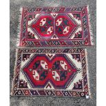 A small tribal rug, with floral borders, 119 x 76cm wide; together with another similar rug, 110 x