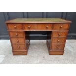 A reproduction burr walnut pedestal desk, 122cm wide.