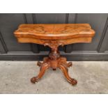 A Victorian figured and carved walnut pedestal card table, 89cm wide.