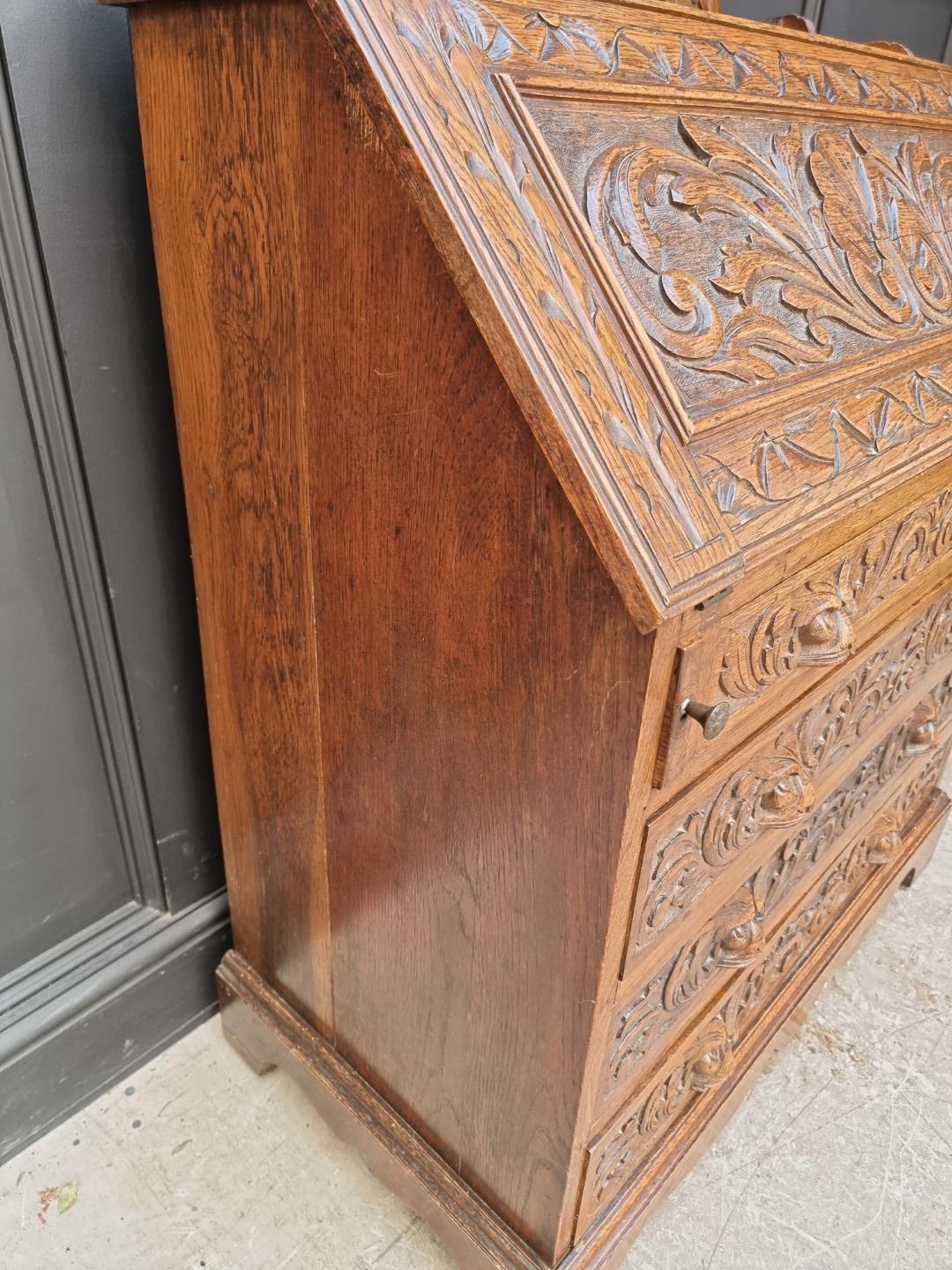 A late 19th/early 20th century carved oak bureau, 91cm wide. - Image 5 of 6