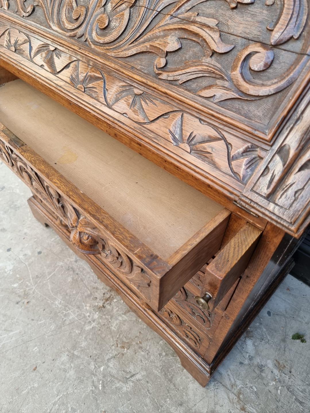 A late 19th/early 20th century carved oak bureau, 91cm wide. - Image 3 of 6