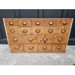 An old pine multi-drawer chest, 78cm high x 132cm wide x 35.5cm deep.