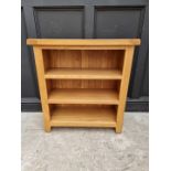 A contemporary pale oak bookcase, 84.5cm wide.