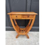 A hardwood occasional table, 61cm wide.