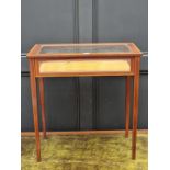 An Edwardian mahogany and satinwood crossbanded bijouterie table, 62.5cm wide.