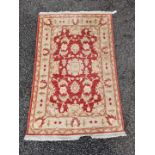 A Persian rug, having allover floral decoration on a cream ground, 156 x 100cm.