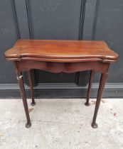 An 18th century style mahogany card table, with serpentine fronted swivel top, 77cm wide.