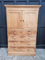 An antique pine chest of drawers, with detachable cupboard superstructure, 130cm wide.