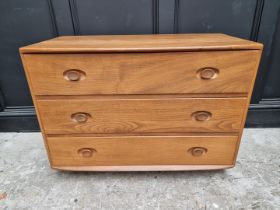 A vintage Ercol elm three drawer chest, 91.5cm wide.