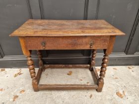 A late 17th century oak single drawer side table, 82.5cm wide.