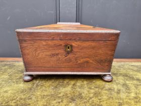 A Regency rosewood sarcophagus tea caddy, 31.5cm wide.