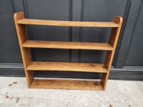 A small antique mahogany table top revolving bookcase, 34.5cm wide.