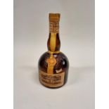 An old 70cl bottle of Grand Marnier 'Cordon Jaune' Liqueur.