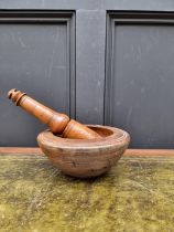A sycamore mortar and fruitwood pestle, the mortar 21.5cm diameter, (split).