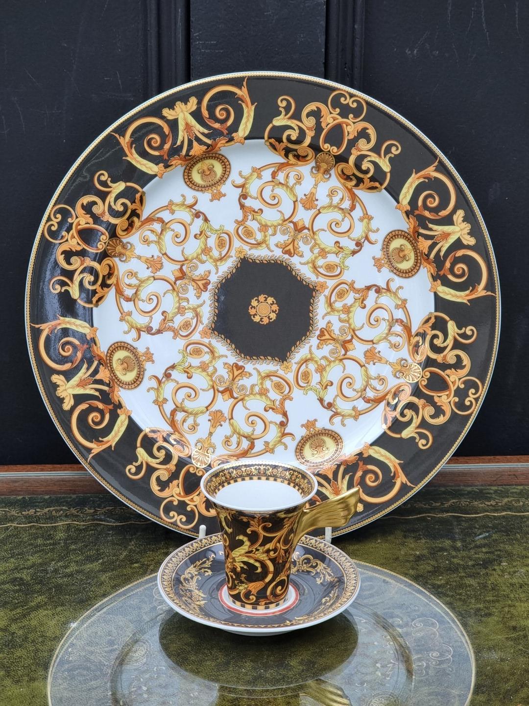 A Rosenthal Versace 'Barocco' pattern plate, cup and saucer, the plate 31cm diameter.