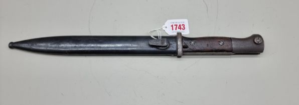 A German World War II M1884/98 Mauser bayonet and scabbard, stamped 'Coppel G.m.b.H 1939'.