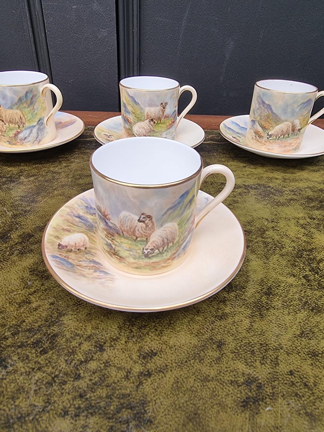 A set of six porcelain coffee cans and saucers, each finely painted with sheep by F Clark. F Clark - Image 7 of 11