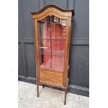 A small Edwardian mahogany and line inlaid display cabinet, 89cm wide.