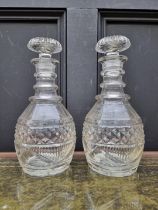 A pair of antique cut glass decanters and stoppers, 28.5cm high.