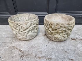 Two small old composition stone garden pots, with relief decoration of animals, 23cm high;