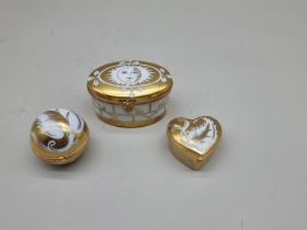 Three Tiffany and Co porcelain boxes, largest 9cm wide.