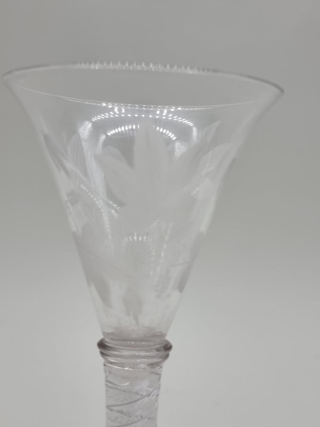 An 18th century opaque twist wine glass, the bowl etched with leaves, 18cm high. - Image 2 of 7