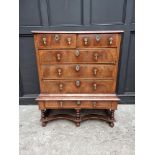 A George I/II walnut, crossbanded and line inlaid chest on stand, 93cm wide, (legs reduced).