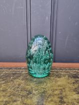 A green glass dump paperweight, 13.5cm high.