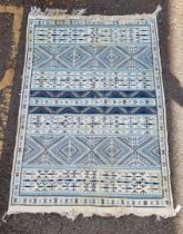 A Tunisian rug, having tribal design, 223 x 163cm.
