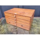A miniature pine chest of drawers, 53cm wide.