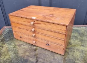 A miniature pine chest of drawers, 53cm wide.