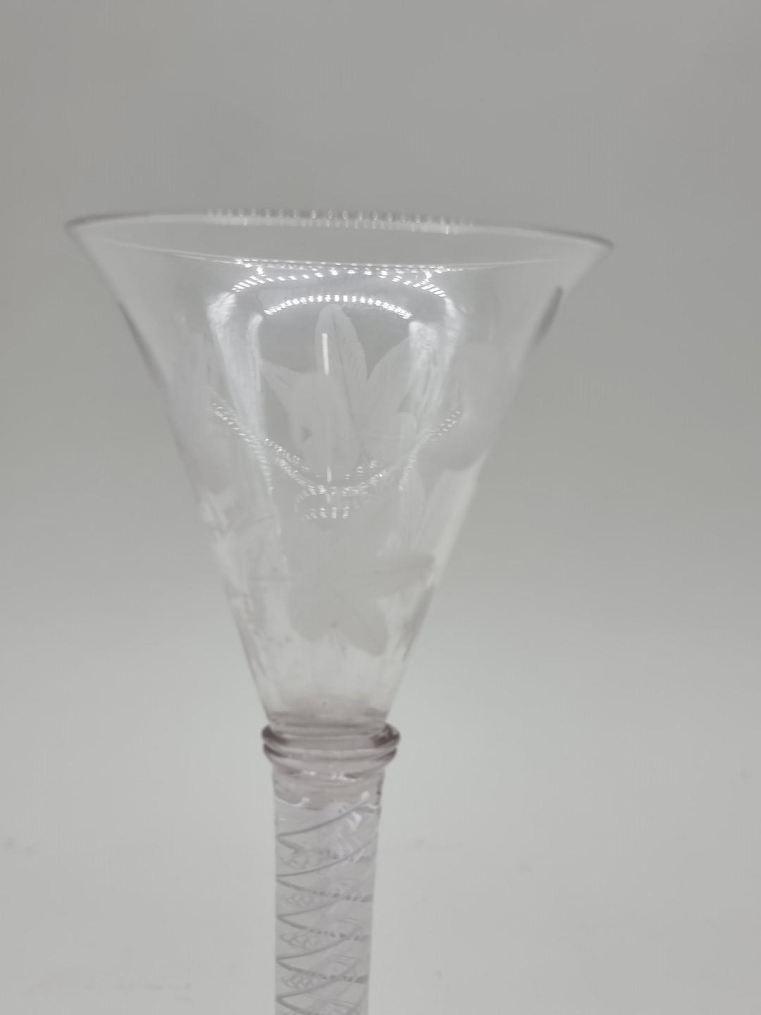 An 18th century opaque twist wine glass, the bowl etched with leaves, 18cm high. - Image 3 of 7