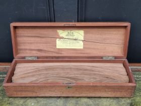 An antique mahogany cased set of draughtsman's templates or patterns, labelled Stanley, 48.5cm wide.