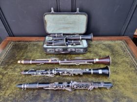 Four clarinets and a flute, one boxed, (s.d.).