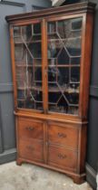 An antique mahogany standing corner display cabinet, labelled 'Muirhead Moffat & Co Antiques,