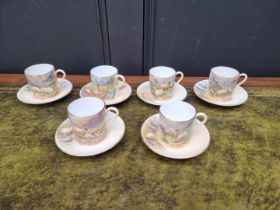 A set of six porcelain coffee cans and saucers, each finely painted with sheep by F Clark. F Clark