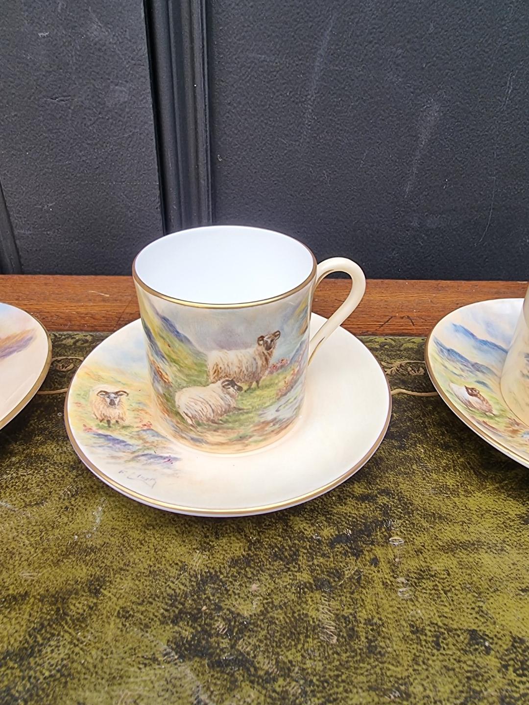 A set of six porcelain coffee cans and saucers, each finely painted with sheep by F Clark. F Clark - Image 4 of 11