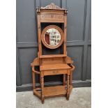 A circa 1900 carved oak hall stand, 107cm wide.