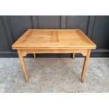 An old Continental pine drawleaf table, 109cm wide when closed.