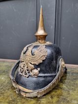 A Prussian infantry NCO's pickelhaube, with eagle helmet plate and brown leather liner.