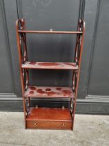 A reproduction mahogany four tier open shelf, 88cm high x 41cm wide.