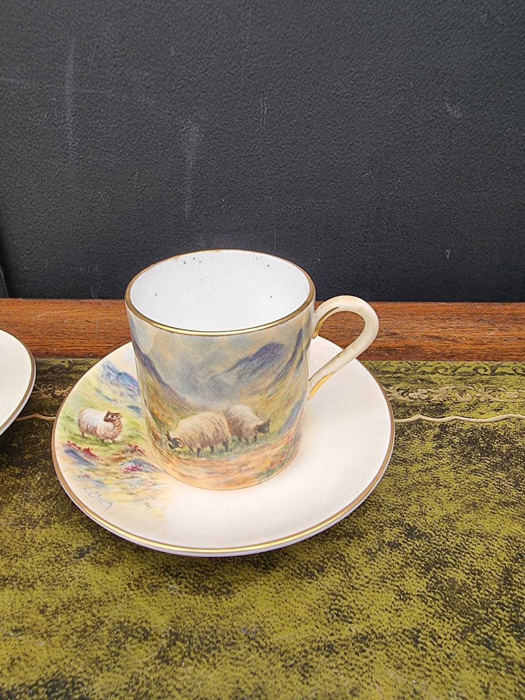 A set of six porcelain coffee cans and saucers, each finely painted with sheep by F Clark. F Clark - Image 5 of 11