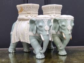 Two Royal Worcester elephant and howdah figures, by James Hadley, 20cm high, each (a.f.).